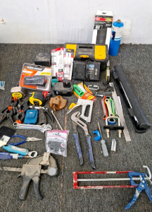 Various wrenches, clamps, measuring tapes, epoxy