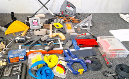 Various assortment of tools ropes and saws