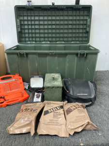 Large storage box, ammo box, hard shell backpack, (3)MRE- assorted meals, Hacksaw, Gun Holster, Lamp