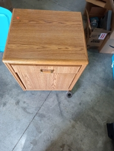Wood file cabinet 27"1/2 long by 23"wide -drawer with handle with push cabinet missing a wheel