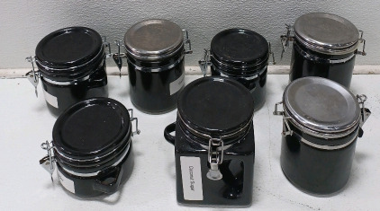 (7) Assorted Black Storage Canisters