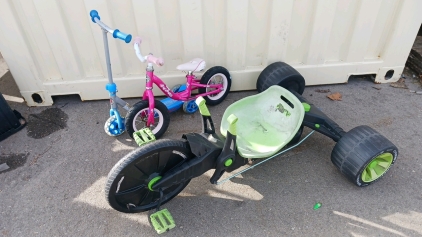 (3) Kids Bikes Including (1) Razor Scooter (1) Huffy Big Wheels (1) Huffy Push Bike