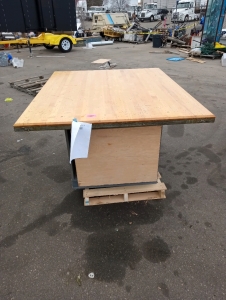 Wood work table steal trim on edges storage cubby 64" by 54" in good condition