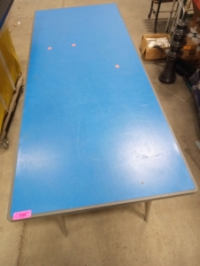 A blue with grey trim picnic table with metal legs good condition 25"tall 72"in length 30"wide