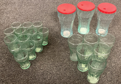(13) Classic Coca Cola Shot Glasses, (6) Classic Coca Cola Kids Sized Drinking Glasses, And (3) Plastic Coca Cola Cups With Lids