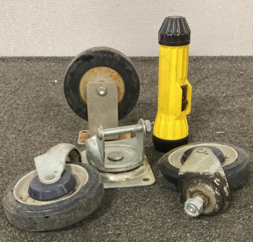 (1) Metal wheel With Rubber, (2) Cart wheels, Working Flashlight, And A Metal wheel Caster.