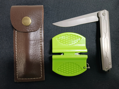 (1) Gray Pocket Knife w/Leather Sheath (1) Knife Sharpener