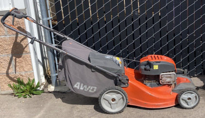 Orange Husqvarna AWD Lawn Mower
