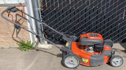 Orange Husqvarna AWD Lawn Mower