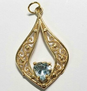 $600 10K Blue Topaz (0.9ct) Pendant