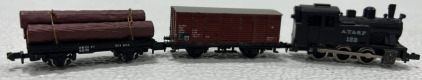 (1) N-Scale AT&SF Locomotive, (1) N-Scale Trix Traincar, (1) N-Scale Tomy Log Traincar