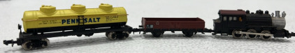 (1) N-Scale Generic Locomotive, (1) N-Scale Trix Flatbed Traincar, (1) N-Scale Bachmann PennSalt Tanker Traincar