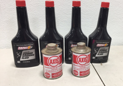 (4) Bottles of Mag1 Premium Power Steering Fluid, (2) Cans of AXIS Concentrated Gear oil Conditioner
