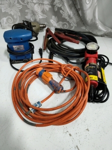 (2) Plug in Work Lights the Craftsman is in working Order (1) Hand Orbital Sander (1) Black and Decor Drill (1) Set of Jumper Cables. powers on