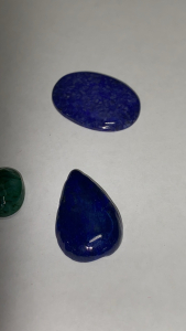 (2) Cut and Facted Brazilian Emeralds 10-10.2 Carat, (3) Lapis Lazuli Cabochon, (2) 32 Carat, (1) 32.1 Carat