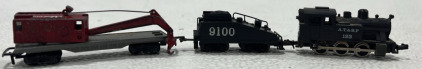 (1) N-Scale AT&SF Locomotive, (1) N-Scale Trix 9100 Coal Traincar, (1) N-Scale LoneStar Locos Crane Traincar