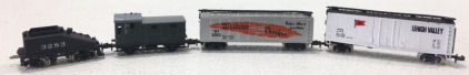 (1) N-Scale Lehigh Valley Traincar, (1) N-Scale Western Pacific 20802 Traincar, (1) N-Scale Trix DB 122861 Traincar, (1) N-Scale Bachmann 3283 Coal Traincar