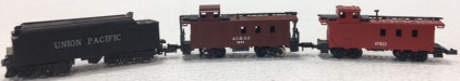 (1) N-Scale AT&SF 1951 Traincar, (1) N-Scale Atlas 47812 Traincar, (1) N-Scale Union Pacific Coal Traincar