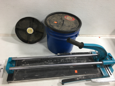 (1) Seeutek tile saw, (1) bucket, and tool caddy