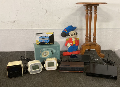 Vintage Sony Clocks And Cassette Recorder, Panasonic Clock Radio, Insignia DVD Player, French Blue 746 Phone, Coronado AM/FM Radio, Vintage Mickey Mouse Pillow, End Table