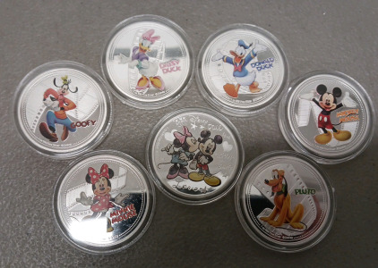 (7) Disney Character Silver Plated Collectible Coins