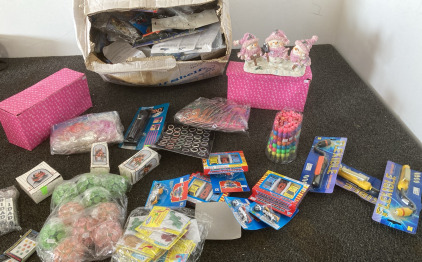 Box Full Of Knick Knacks Including Toy Motorcycle And Cars, Flashlights Christmas Decorations, Costume rings