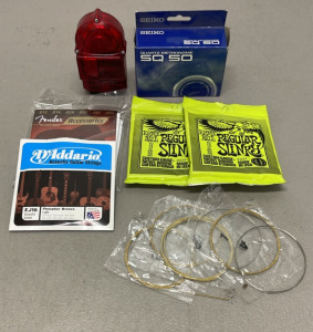 (1) Seiko Quartz SQ 50 Metronome, (4) Sets Of Guitar Strings, (6) Single Guitar Strings