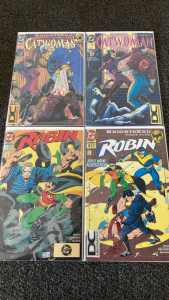 (4) DC Comic Books in Plastic: (2) Catwoman, (2) Robin