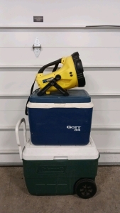 (1) Coleman 48qt Cooler W/Handle & Wheels (1) Gott 34qt Cooler (1) Cyclops 15 Mill Candle Power Spotlight