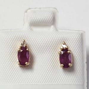 $700 14K Ruby And Diamond Earrings