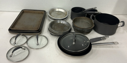 (6) Different Size Pots W/ 4 Lids, (3) Different Size Pans, (6) Baking Trays And More