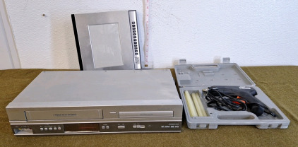(1) Phillips VHS/DVD Player, (1) Glue Gun W/Case & (1) Talking Photo Album