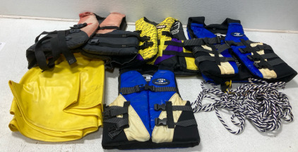 (4) Life Jackets Of Assorted Sizes (1) Yellow Inflatable Tube (1) Rope