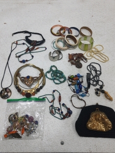 (25)Assorted Costume Jewlery, (2)Hand Bags,(1) Kenneth Cole Wrist Watch & More.