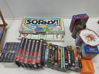 (23) Assorted VHS Movies. (6) Decisive Tins, (2) Board games & More