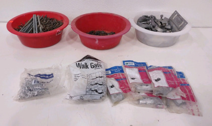 Three bowls of assorted nails/ screws w/ gate pieces