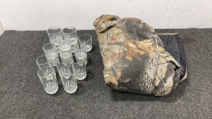 Drinking glasses and camo coveralls