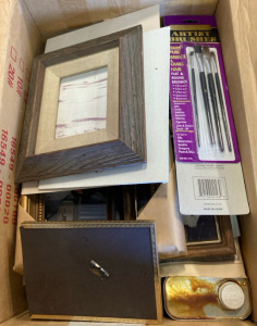 Assortment Of Art Supplies Including Frames, Brushes, And Paint