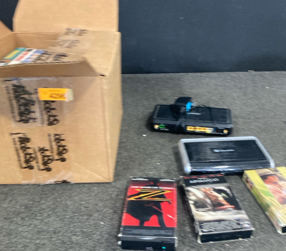 (2) Centurylink Wifi Routers & Box Of Vhs Movies