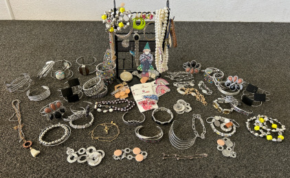 Plastic Bin Of Fashion Jewelry, Unverified Gucci Watch, & Black Wire Jewelry Display