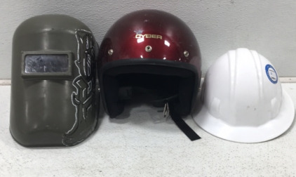 (1) Green Welders hat (1) Red Cyber motorcycle helmet (1) white construction hard hat