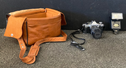 AE-1 Canon Film Camera 52mm Rolev Lens, And Sunpak Auto Zoom 933 Flash, and Brown Leather Camera Bag