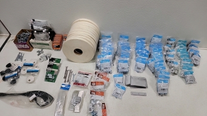 Assortment of nuts, bolts, washers in so sizes in length and width. (10)Rolls of foam adhesive, several steel strapping seals, several aluminum Z clips, electrical straps and screw connectors. Pressure nozzle, (3) spring grips (1) metal hanger strap, seve