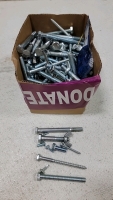 Assortment of nuts, bolts, washers in so sizes in length and width. (10)Rolls of foam adhesive, several steel strapping seals, several aluminum Z clips, electrical straps and screw connectors. Pressure nozzle, (3) spring grips (1) metal hanger strap, seve - 9