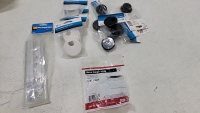 Assortment of nuts, bolts, washers in so sizes in length and width. (10)Rolls of foam adhesive, several steel strapping seals, several aluminum Z clips, electrical straps and screw connectors. Pressure nozzle, (3) spring grips (1) metal hanger strap, seve - 12