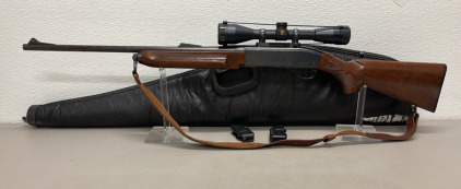 Remington Model 7400 270 Winchester Caliber, Semi Automatic Rifle W/ Extra Magazine, Scope, And Patent Leather Gun Case