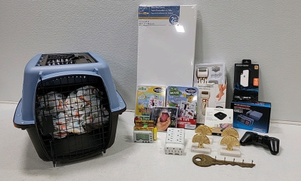 Cat/Dog traveling kennel. Few small electronics, brass napkin holders, traveling games for kid and a Rechargeable callus remover