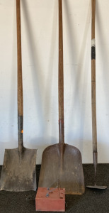 Shovels, a garden digger, and gopher trap