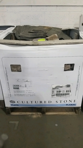 Building Stone/Brick Material. W/ Some Roofing Material.