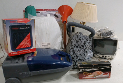 (1) Table Lamp (1) Kenmore Vacuum w/ Attachments (1) Magnavox TV w/ Antenna (1) Percussion Massager w/ Heat (2) Magazine/Book Racks (1) The "Quad" Stool (1) Toilet Seat (Still Wrapped) and More!